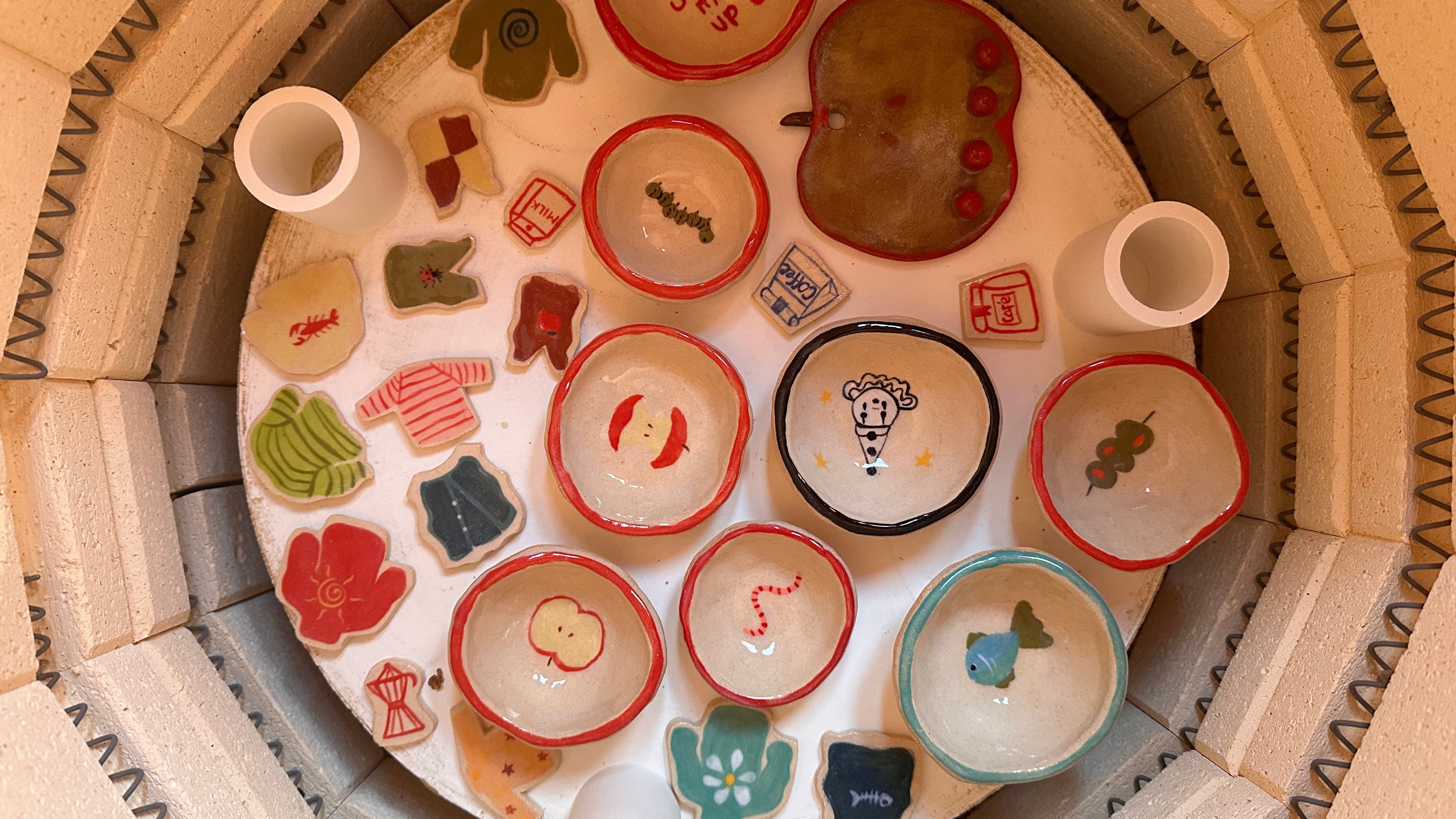 Collection of ceramic magnets inside kiln